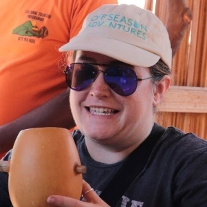 Lindsay Booth of Off Season Adventure with banana beer in Tanzania 300sq