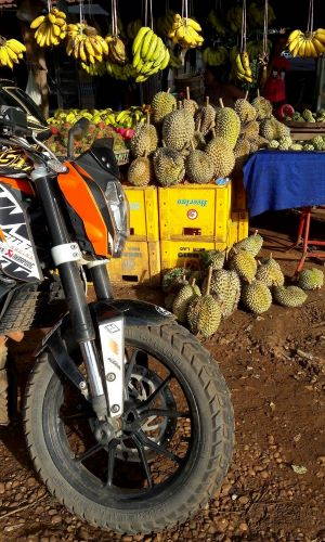 A fuel stop for the rider at a local market. Image by Chris Mulder via KTM Laos.