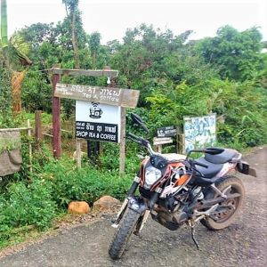 Dropping in to support a local "shop tea & coffee". Image by Chris Mulder via KTM Laos.