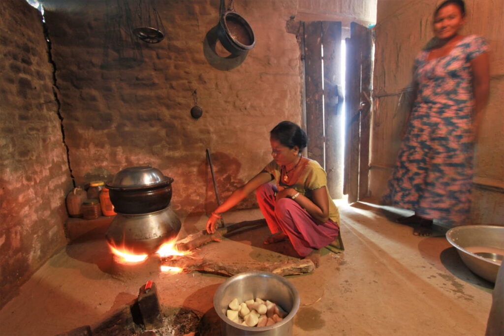 Hosts preparing to local delicacies at Barauli Community Homestay, which is at the western end of Chitwan National Park, Nepal. Image courtesy Community Homestay Network.