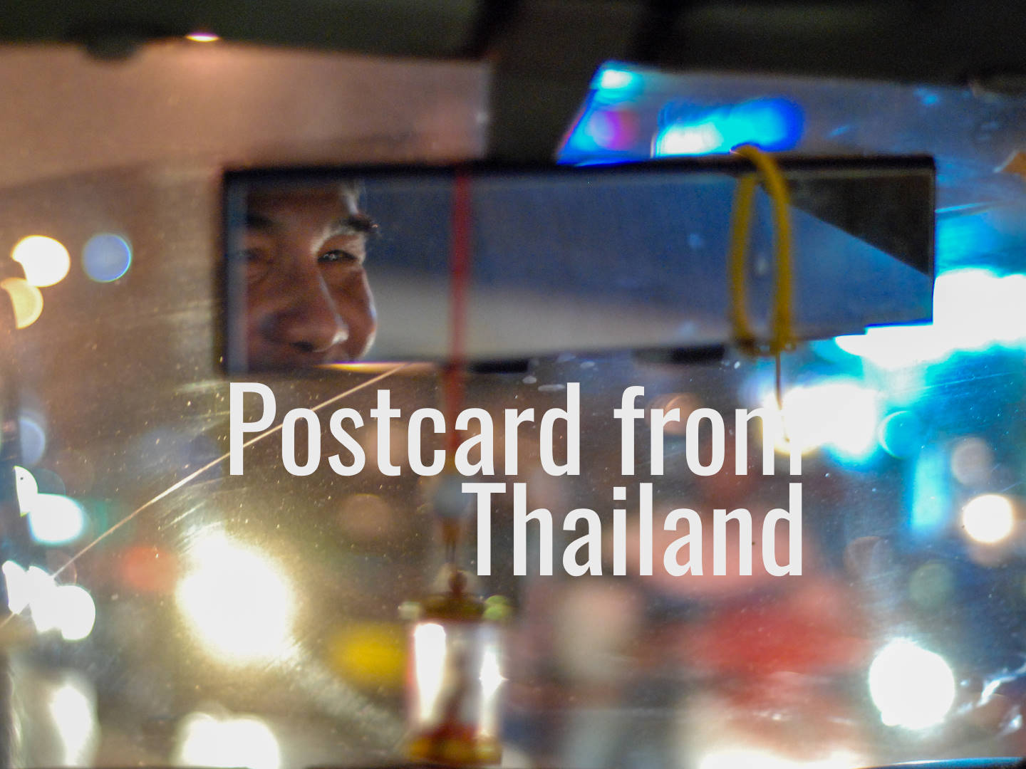 Postcard from Thailand The smiling eyes of a Bangkok taxi driver Image by David Gillbanks